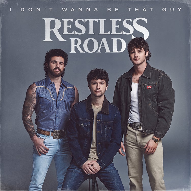The album cover for Restless Road. A gray background wth three men standing straight on